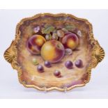 A Royal Worcester two handled shallow bowl, the reserve painted with peaches, gooseberries, cherries