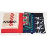 A collection of three designer silk scarves to include  a Burberry with signature red, beige,