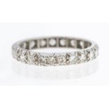 A diamond set platinum eternity ring, comprising round cut diamonds each approx 2mm, total diamond