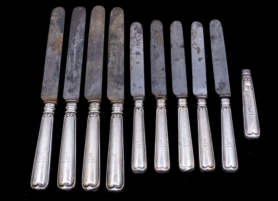 A collection of Sheffield silver handled steel bladed table knives, probably by Mappin and Sons.