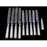 A collection of Sheffield silver handled steel bladed table knives, probably by Mappin and Sons.