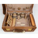 A Victorian silver gilt mounted hob nail cut travelling dressing table set, the mounts hallmarked by