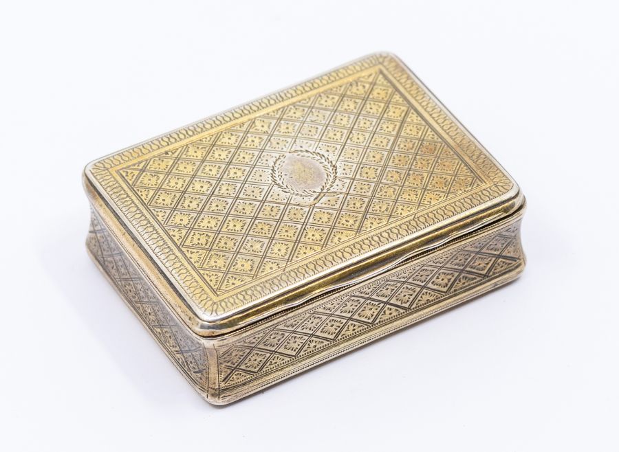 A George III silver gilt snuff box, with engraved baluster border, the body with shaped diamond
