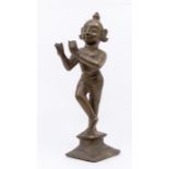 Am early 20th Century Central Indian cast brass figure of Krishna standing, flute lacking, 21cm high