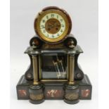 A large Victorian slate mantle clock with a French movement and jewelled skeletonised Brocot style