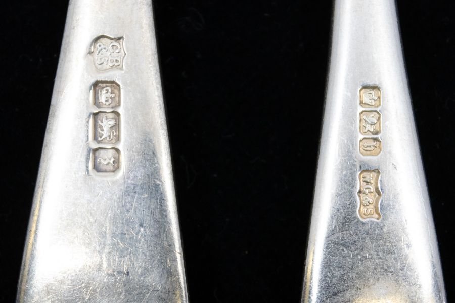 A collection of six early 20th Century silver Hanoverian pattern table forks, four engraved with - Image 2 of 2