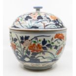 A Japanese Imari porcelain large covered bowl, early 18th Century, decorated with a profusion of