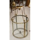 A large Georgian style brass bound hall lantern, circular body, glass panel, single central light,