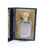 A 19th Century gold scent bottle facet cut scent bottle with stopper, the hinged gold coronet shaped