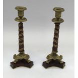 19th century pair of French Ormolu candlesticks. Tripod lion’s paw base, with central wooden column,