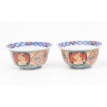 A pair of Japanese porcelain bowls, early 19th Century, ogee shape decorated with figures in