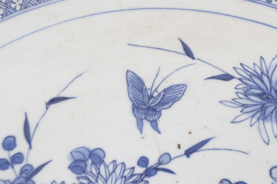 A Chinese blue and white porcelain shallow dish, Qing Dynasty, 19th Century, decorated with - Image 3 of 3