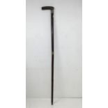 An Edwardian walking cane, horn handle above silver collar engraved with 'Calamon Circa 100 BC'