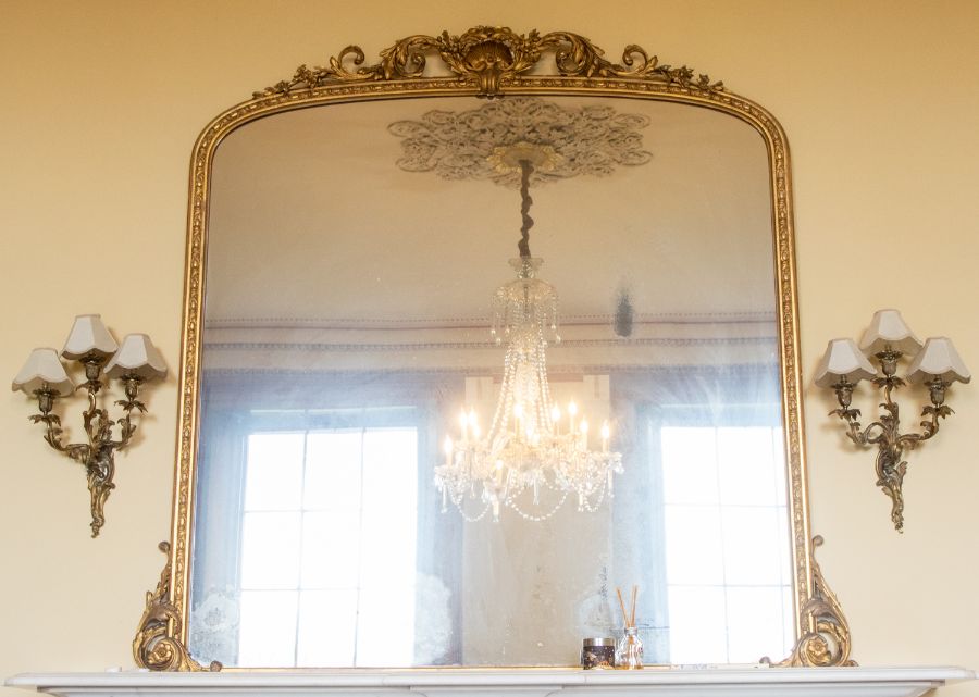 A 19th Century Rococo Revival gilt overmantle mirror with original pier glass, shell and foliage