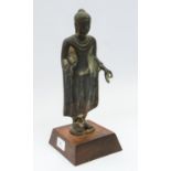 A Thai bronze standing figure of Buddha in 8th/9th century style, enrobed, hands held in