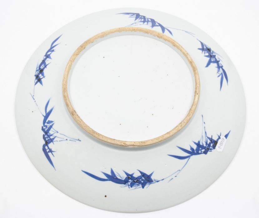 A Chinese blue and white porcelain shallow dish, Qing Dynasty, 19th Century, decorated with - Image 2 of 3