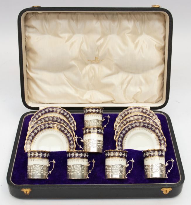 A set of six George VI silver mounted Aynsley china coffee cans with matching saucers, pattern no: