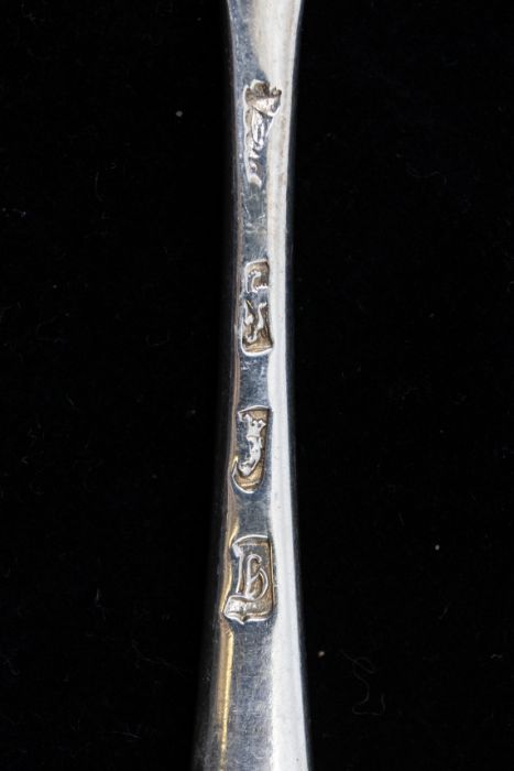 A set of three George III Old English Pattern silver table spoons, each engraved with a crest, - Image 2 of 2