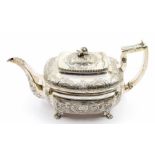 A George III Irish silver teapot, rectangular form profusely chased and engraved with flowers and