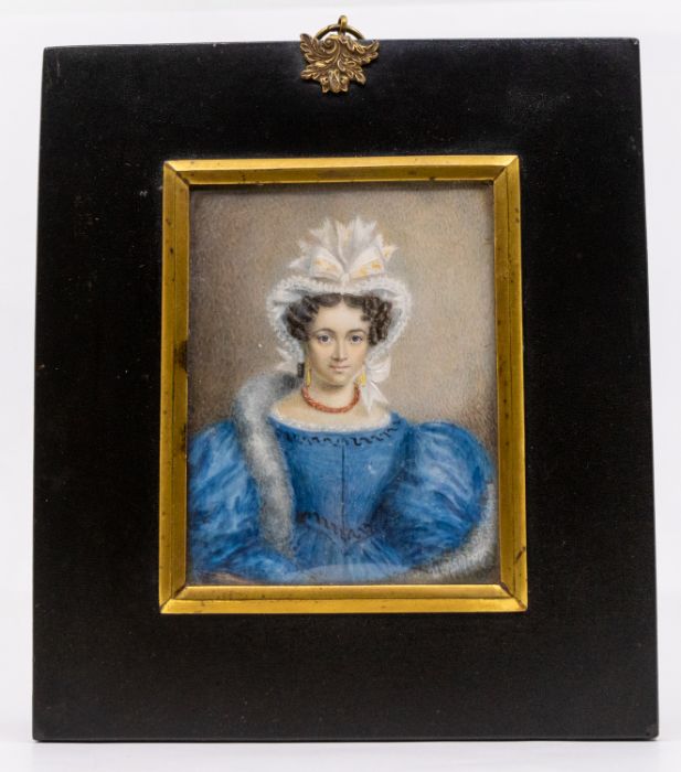 Early 19th Century School, circa 1830 Portrait miniature of a Lady wearing blue dress, ribbon topped