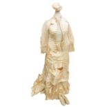 A late Victorian, circa 1880, duchess satin wedding dress, made by Bevern Robes et Modes,