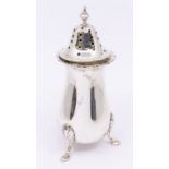 An Elizabeth II silver caster, pear shaped body with wavy rim, on three anthemion and hoof feet,