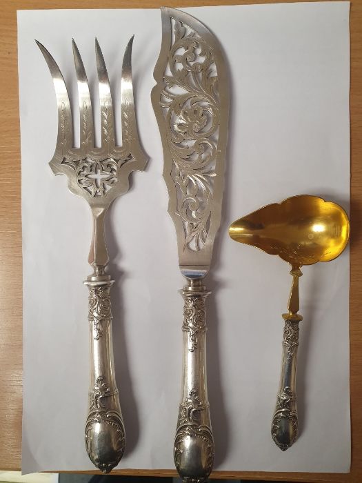 A pair of 19th Century French 950 standard fish servers, ornate engraved blade and tines, hallmarked