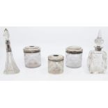 A collection of silver topped glass items to include; a cut glass ink jar with engine turned