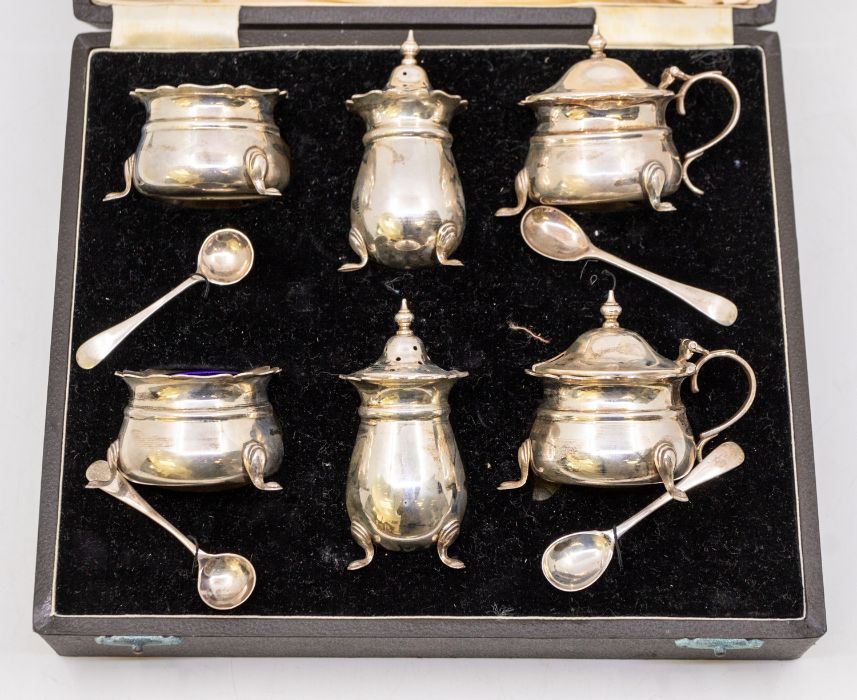 A George VI silver six piece condiment set to include: two pairs of salts, mustard pot & covers,