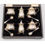 A George VI silver six piece condiment set to include: two pairs of salts, mustard pot & covers,