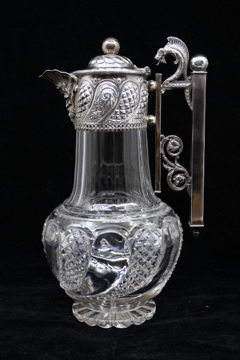 A Victorian silver mounted cut glass claret jug, the silver collar chased with fluted hob nail