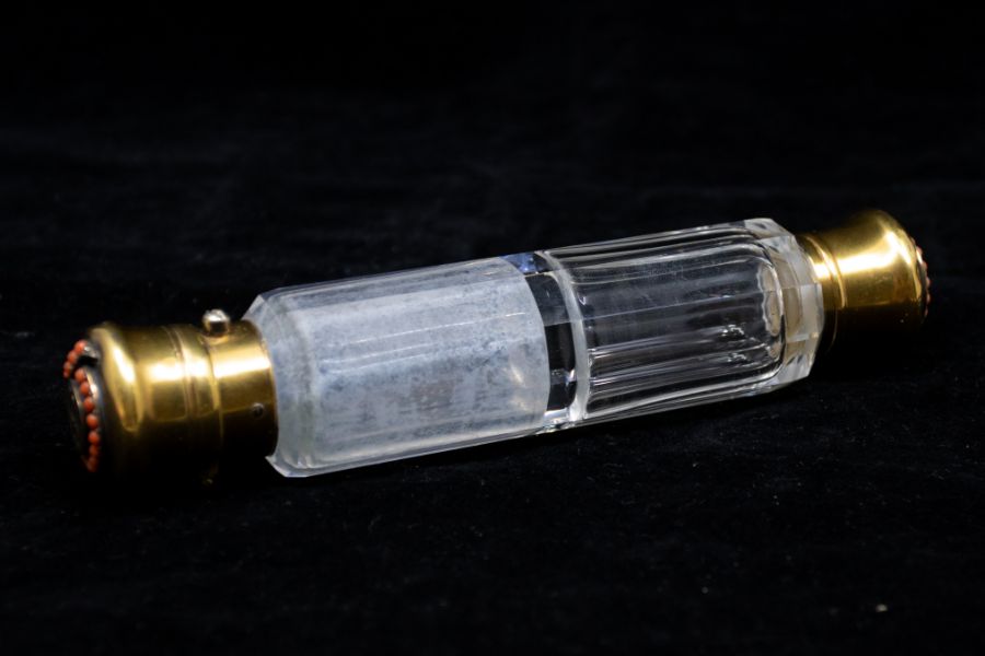 An early Victorian gilt mounted double ended scent bottle, the covers inset with coral bead