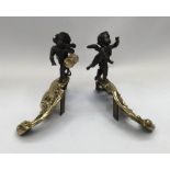 A pair of neo-classical Louis XV style cast brass and bronzed andirons. Acanthus leaf decoration