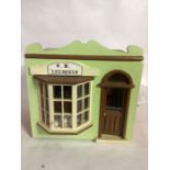 Dolls House antique shop; A charming dolls house opening front window antique shop with counter