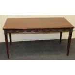 An Edwardian mahogany serving table, the rectangular top over swagged frieze, raised on fluted