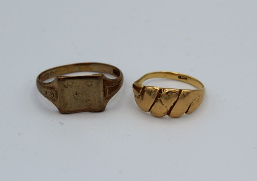 Two rings, one an 18ct stamped yellow metal ring, approximate weight 3.2gm, the other a 9ct gold