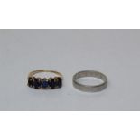 A pair of rings, one a white metal band, approximate weight 5.7gm, size N, marked platinum, along