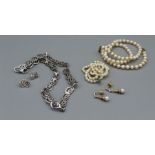 A selection of jewellery comprising two graduated strands of pearls, one with a 375 stamped clasp, a