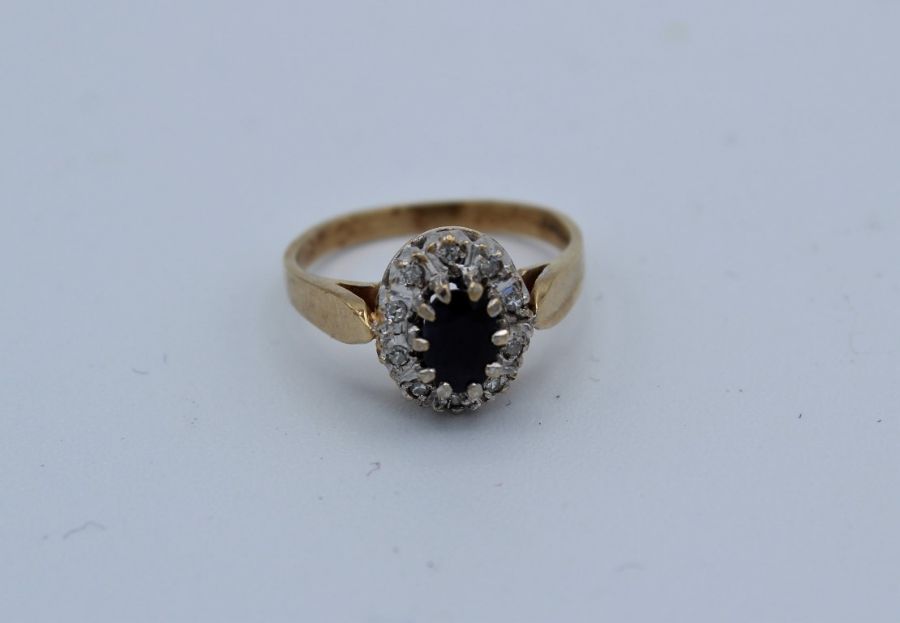 A sapphire and diamond 9ct gold ring, size L. Gross weight approximately 2.5gm