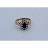 A sapphire and diamond 9ct gold ring, size L. Gross weight approximately 2.5gm