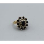 A 9ct gold sapphire and diamond cluster ring, gross weight approximately 4.8gm