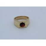 A 9ct gold garnet set gentleman's ring, size K. Gross weight approximately 13.4gm