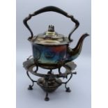 An Edwardian silver plated spirit kettle with ebonised fittings, on associated stand with reservoir