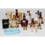 A collection of Wade relating to Whisky including ten mallet shaped flasks of various sizes, for