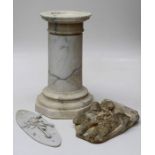 A veined white marble column on an octagonal plinth, 59cm high, a cast reconstituted figural