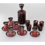 A set of six mid 20th century Continental cranberry glass and white metal overlaid gluhwein cups and