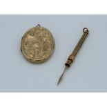 A 9ct gold locket with a yellow metal toothpick/cigar piercer. Approximate weight of locket 5.6gm,