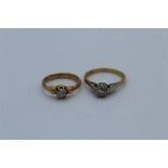 An 18ct and plat stamped diamond solitaire ring, size K, Gross weight approximately 2.8gm.