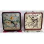 Alarm Clocks: A pair of vintage animated alarm clocks by Ingraham, Canada. the Mountie and Bugs