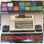 Philips: A boxed Phillips Videopac G7000 computer with seven games cartridges. Computer console,